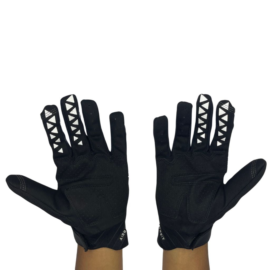white and black padded gloves with 100% logo, made from cloth material, featuring impact and palm padding, breathable design, adjustable closure, and touchscreen compatibility for track use."