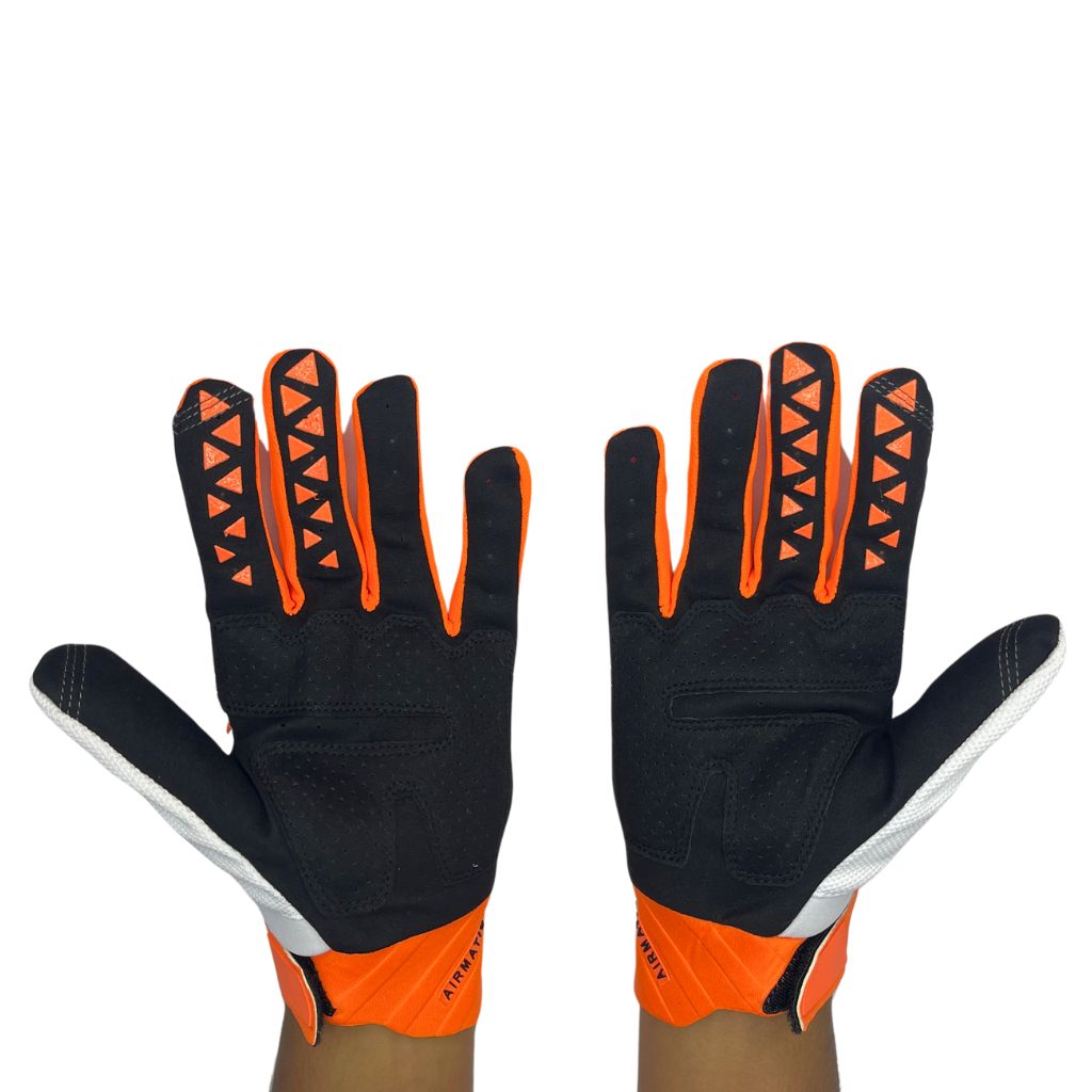 white and orange padded gloves with 100% logo, made from cloth material, featuring impact and palm padding, breathable design, adjustable closure, and touchscreen compatibility for track use."