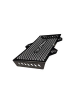 Black metal grille with perforated design on a white background