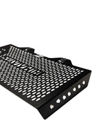 Black metal grille with perforated design on a white background