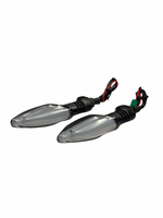 Two motorcycle turn signals on a white background