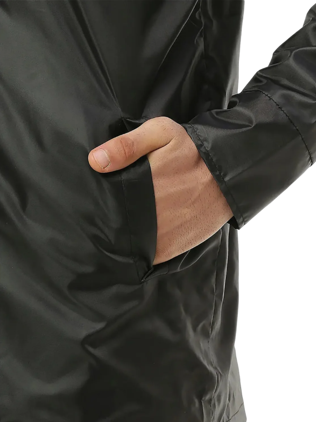 Close-up of a person wearing a black jacket with a hand in the sleeve pocket.