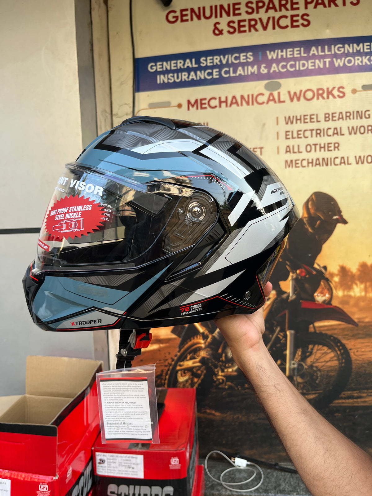 Studds Trooper D2 Black N4 Grey Helmet offers a stylish and sturdy design with advanced safety features for a secure and comfortable ride.