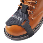 A shoe guard is a protective accessory designed to shield your footwear from wear and tear caused by gear shifting while riding motorcycles. Made from durable materials, it ensures comfort and style, preventing scuffs and stains on your shoes. Ideal for daily riders and enthusiasts.