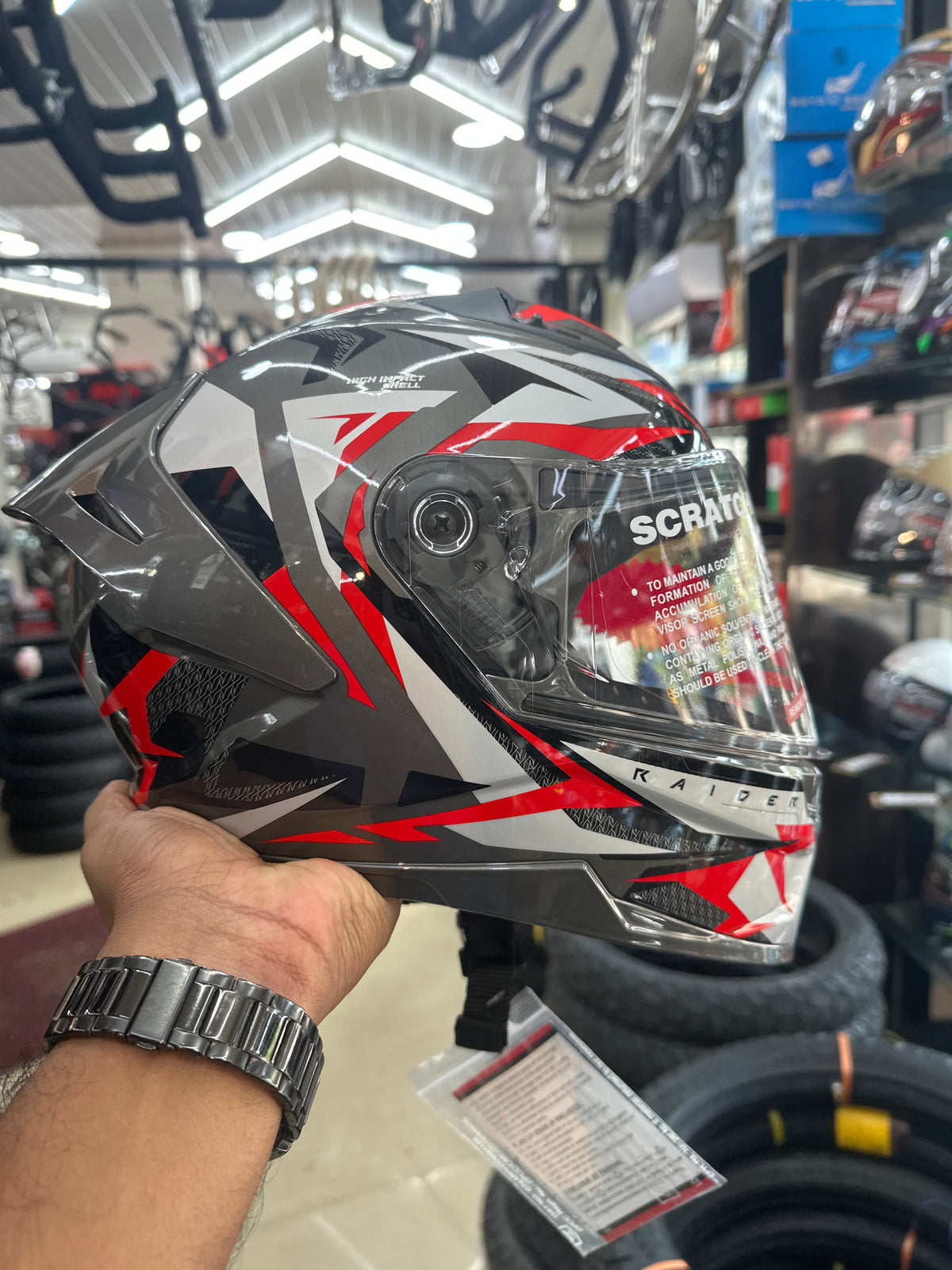 The Studds Raider Super D1 Black N2 Red helmet combines a stylish design with high safety standards, ensuring a comfortable and secure ride.