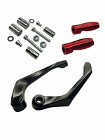 Mechanical parts including black levers, red components, and metal washers on a white background