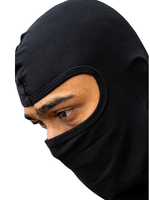 Person wearing a black balaclava on a white background