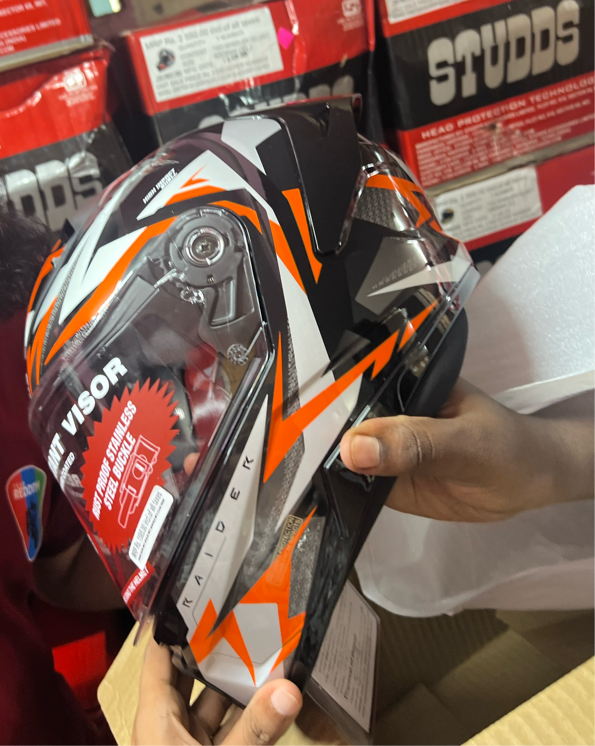 The Studds Raider Super D1 Black N10 Orange helmet features a sleek design with reliable safety, offering both style and protection for riders.