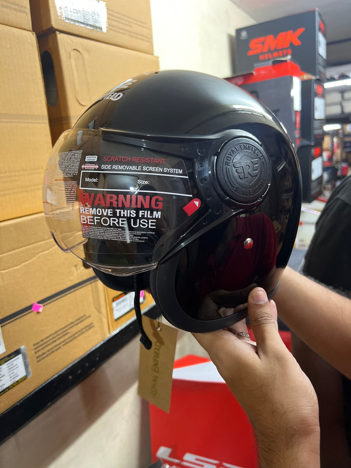 The Royal Enfield HESS22002 OP MLG Gloss Black helmet combines premium safety features with a sleek, glossy black finish. Designed for comfort and durability, it’s perfect for riders seeking style and protection on every journey.