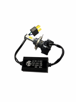 Car headlight bulb and adapter on a white background