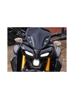 MT 15 Short Glossy Visor – a compact and stylish visor designed for the Yamaha MT-15. Featuring a glossy finish, it enhances the bike's appearance while providing effective wind protection. This short visor offers improved visibility and comfort, making it ideal for riders who prefer a sleek, minimalistic look without sacrificing performance.
