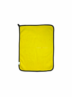 Yellow towel with black border on a white background