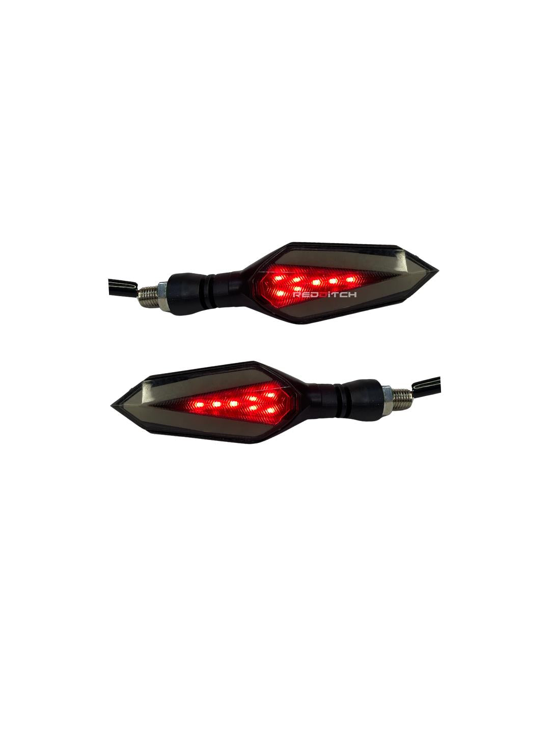 Spear Arrow Indicator 2.0 with dual lighting functionality, illuminating bright yellow for signaling and red for braking, enhancing safety and visibility.