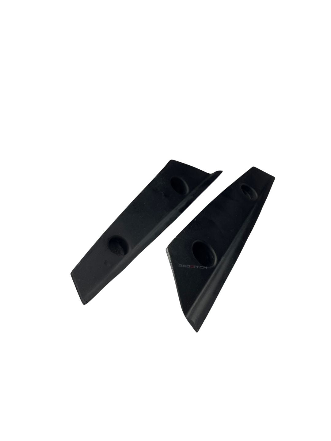 Two black triangular rubber blocks on a white background