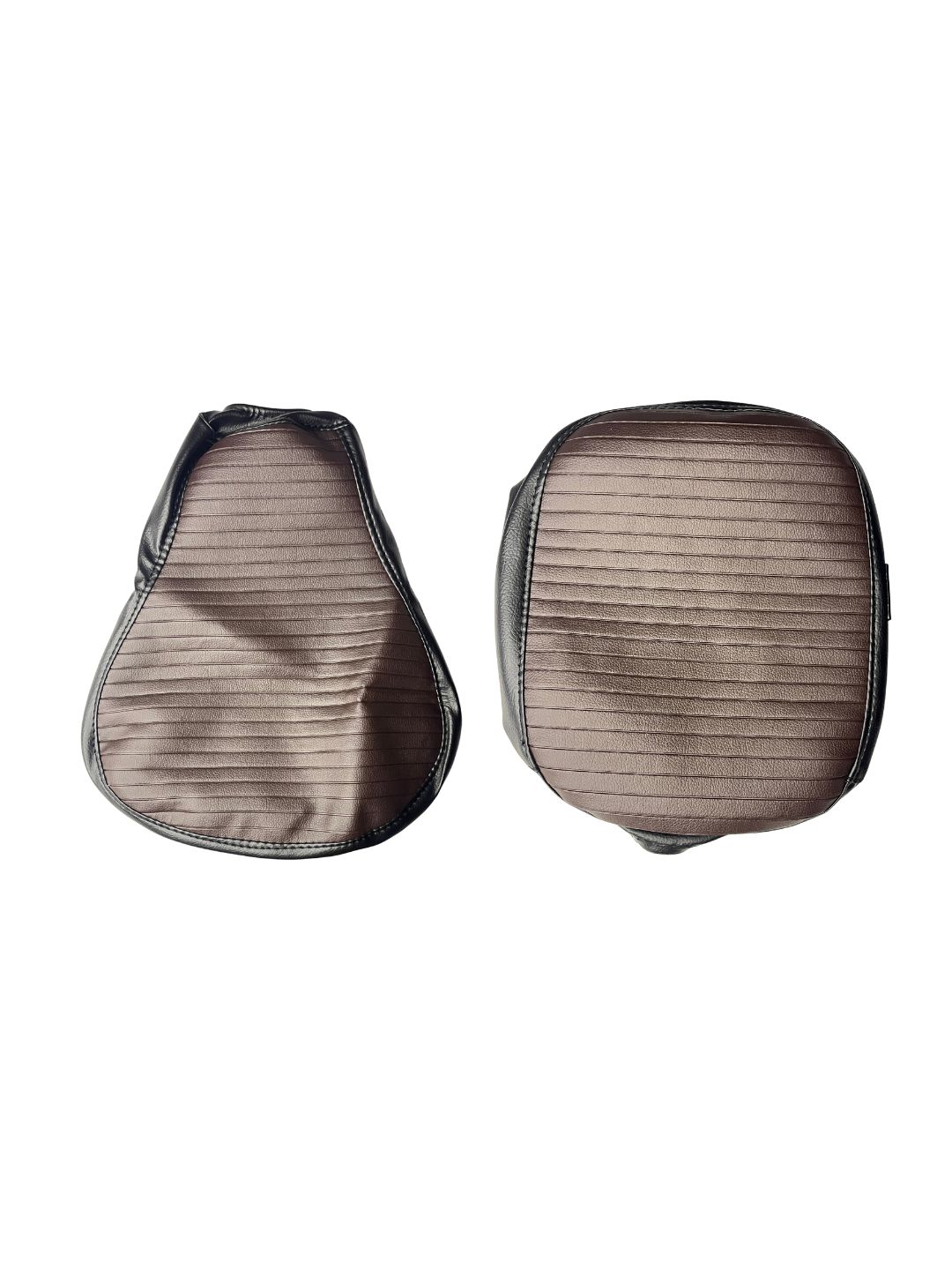 Pair of brown leather saddle pads on a white background