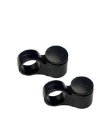 Two black metal connectors on a white background