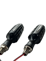 Two motorcycle turn signals on a white background