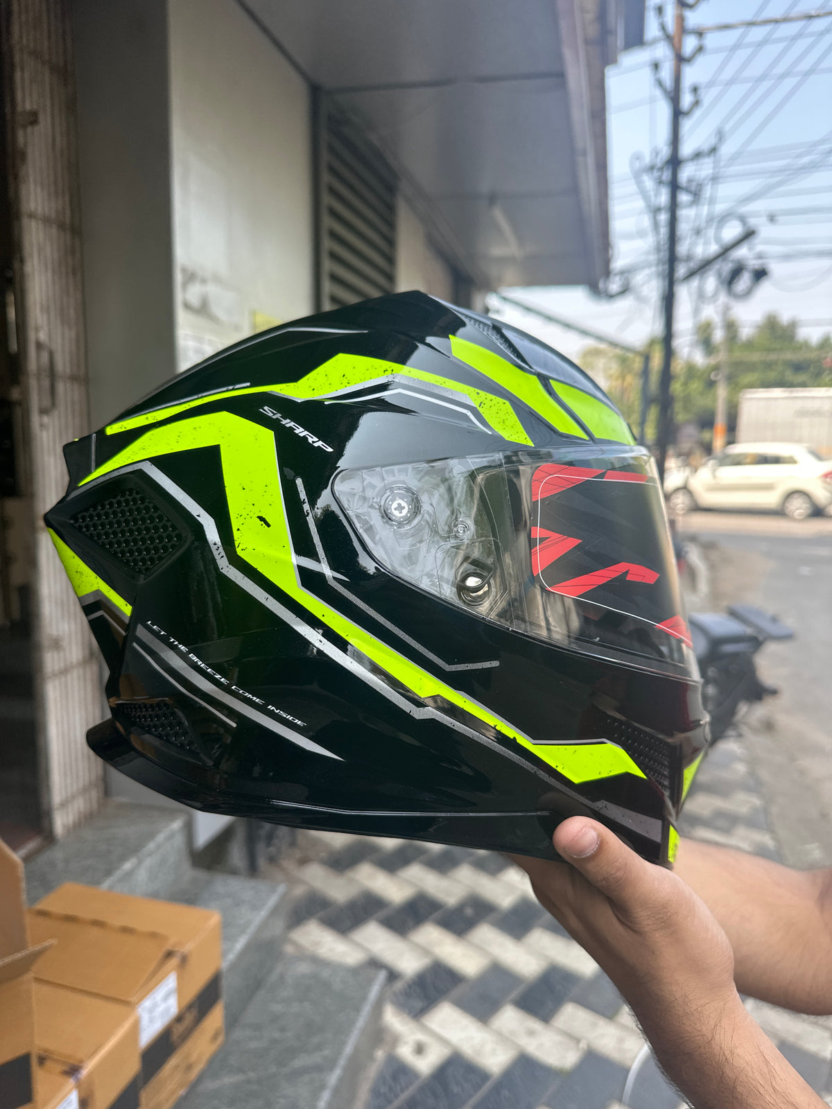 Steelbird SBH 25 Sharp Spirit Glossy Black/Neon Helmet combines safety with a sleek design, offering comfort and durability for riders.