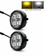 Two black round LED light pods with clear lenses, shown on a white background with a small inset demonstrating dual color modes: yellow when on and white when on.