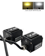 Two black Moto Genius LED light modules with a black cable connecting them, shown on a white background with a small inset showing dual color output: yellow and white.