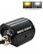 A black Moto Genius motorcycle LED light with a silver metal connector, shown on a white background with a small inset demonstrating dual color output: yellow and white.