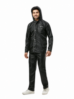 Person wearing a black raincoat and pants on a white background