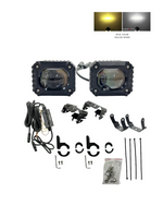 Two LED work lights with mounting brackets and wiring on a white background.