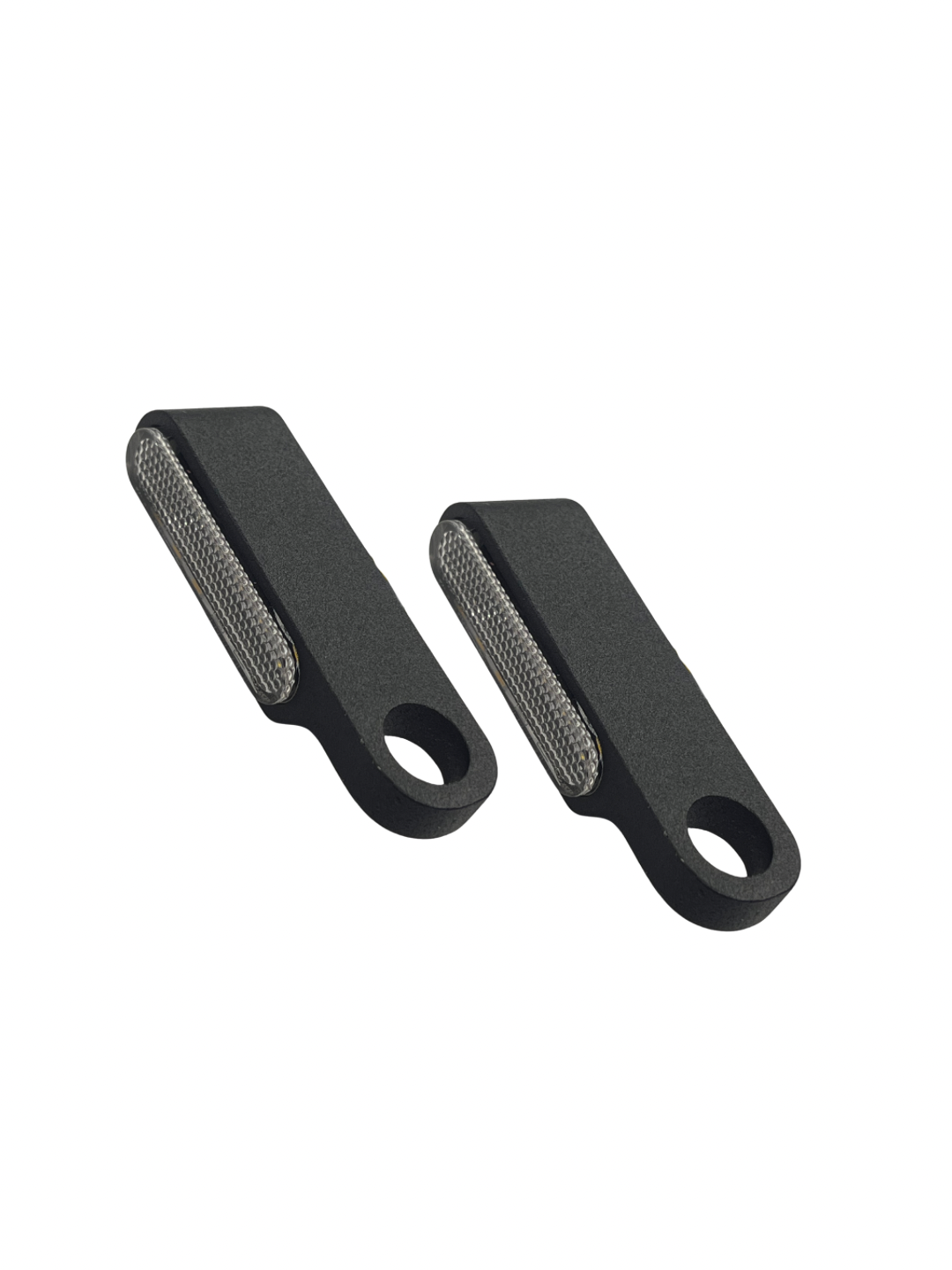 Two black fabric shaver tools on a white background
