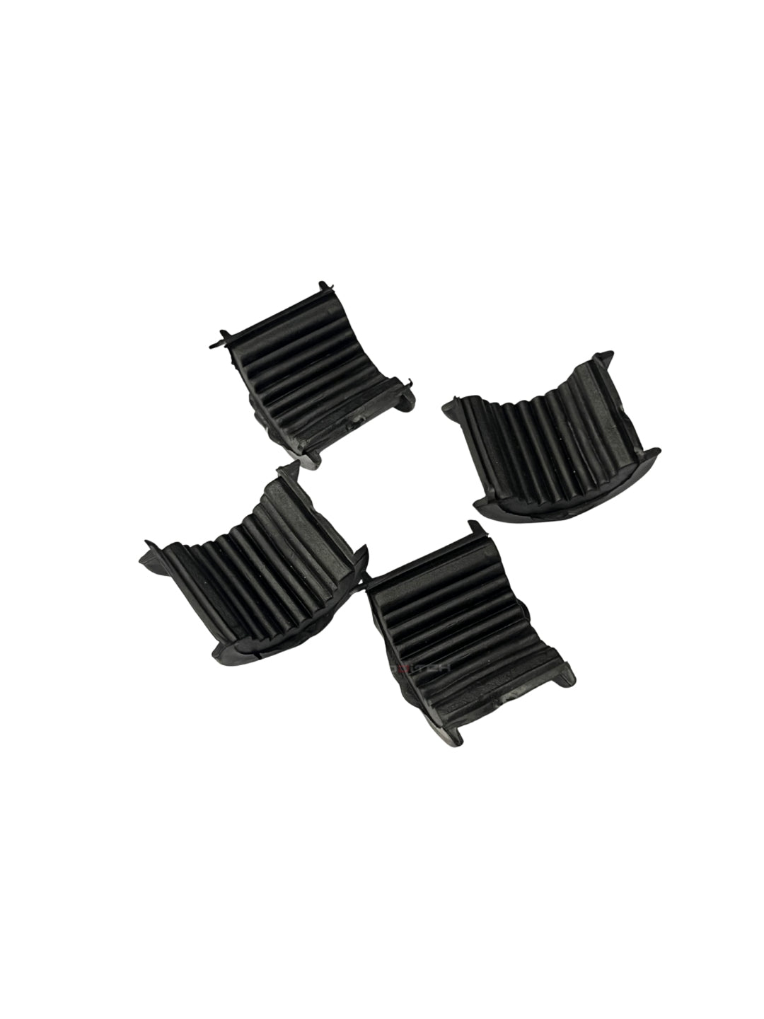 Four black plastic components on a white background
