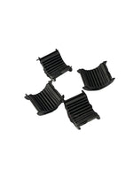 Four black plastic components on a white background